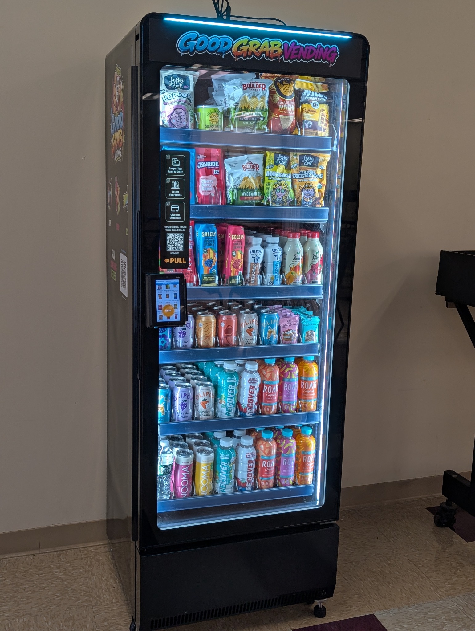 Good Grab Vending machine stocked with snacks and drinks, photographed at an angle